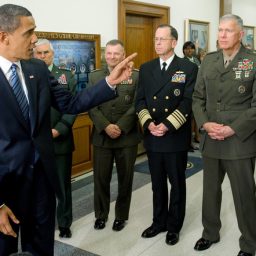 US President Barack Obama, with US Vice President Joe Biden (L) and Chairman of the Joint Chiefs of Staff, Admiral Mike Mullen (C), speaks alongside the Joint Chiefs of Staff and US Secretary of Defense Robert Gates (R) after meetings at the Pentagon in Washington, DC, January 28, 2009. AFP PHOTO / SAUL LOEB/AFP/Getty Images