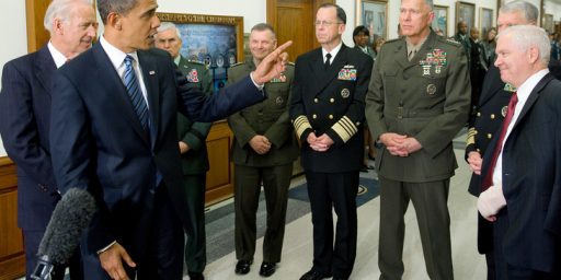 US President Barack Obama, with US Vice President Joe Biden (L) and Chairman of the Joint Chiefs of Staff, Admiral Mike Mullen (C), speaks alongside the Joint Chiefs of Staff and US Secretary of Defense Robert Gates (R) after meetings at the Pentagon in Washington, DC, January 28, 2009. AFP PHOTO / SAUL LOEB/AFP/Getty Images