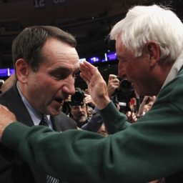 Duke head coach Mike Krzyzewski (L) is embraced by his mentor former Indiana coach Bobby Knight after Duke defeated Michigan State in their NCAA men's basketball game in New York November 15, 2011. The win was Krzyzewski's 903rd, surpassing Knight's record as the most wins ever as a college coach.
