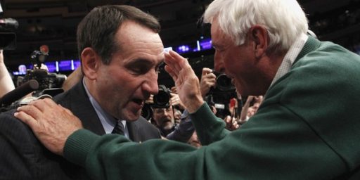 Duke head coach Mike Krzyzewski (L) is embraced by his mentor former Indiana coach Bobby Knight after Duke defeated Michigan State in their NCAA men's basketball game in New York November 15, 2011. The win was Krzyzewski's 903rd, surpassing Knight's record as the most wins ever as a college coach.