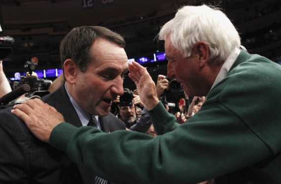 Duke head coach Mike Krzyzewski (L) is embraced by his mentor former Indiana coach Bobby Knight after Duke defeated Michigan State in their NCAA men's basketball game in New York November 15, 2011. The win was Krzyzewski's 903rd, surpassing Knight's record as the most wins ever as a college coach.