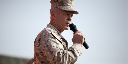 Commandant of the Marine Corps, Gen. James F. Amos, addresses a crowd of U.S. Marines and Sailors at Camp Leatherneck, Afghanistan Dec. 23. Amos expressed his admiration to the service members for their accomplishments and dedication to supporting the ongoing counterisurgency mission, especially while deployed during the holiday season.