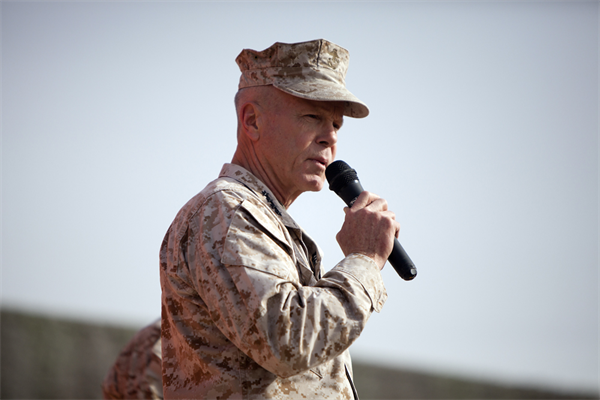 Commandant of the Marine Corps, Gen. James F. Amos, addresses a crowd of U.S. Marines and Sailors at Camp Leatherneck, Afghanistan Dec. 23.  Amos expressed his admiration to the service members for their accomplishments and dedication to supporting the ongoing  counterisurgency mission, especially while deployed during the holiday season.