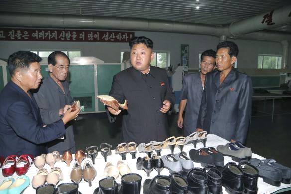 North Korean leader Kim Jong Un provides field guidance during his visit to the Wonsan Shoe Factory