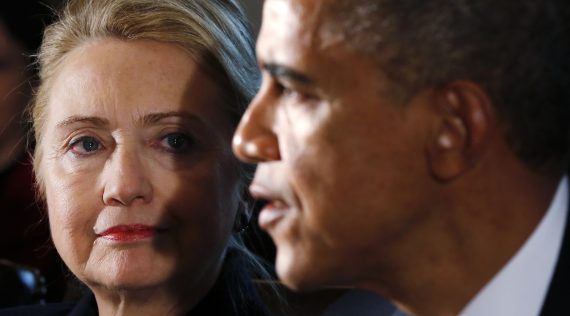 U.S. Secretary of State Clinton listens to U.S. President Obama speak during a meeting with members of his cabinet in Washington