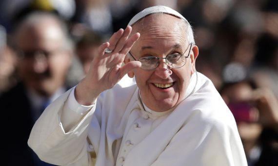 Pope Francis waves to crowds as he arrives to his inauguration mass on 19 March 2013.