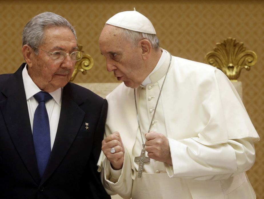 Pope Francis talks with Cuban President Raul Castro during a private audience at the Vatican