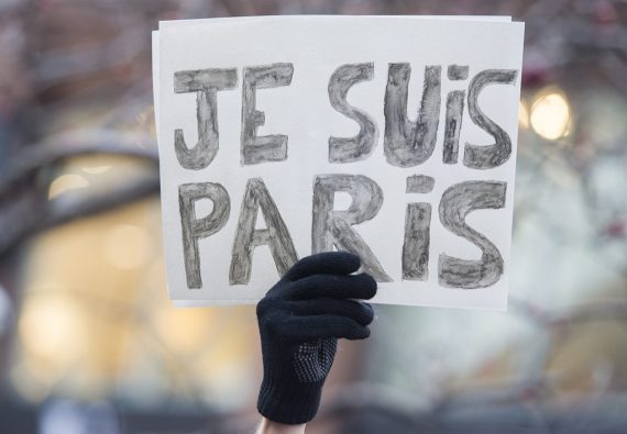 A man holds up a sign which reads, "Je Suis Paris" ("I Am Paris") during a rally of solidarity outside the Consulate of France in Montreal, Quebec, Canada on Saturday, Nov. 14, 2015, to show his support to victims of the Paris attacks. (Graham Hughes/The Canadian Press via AP)
