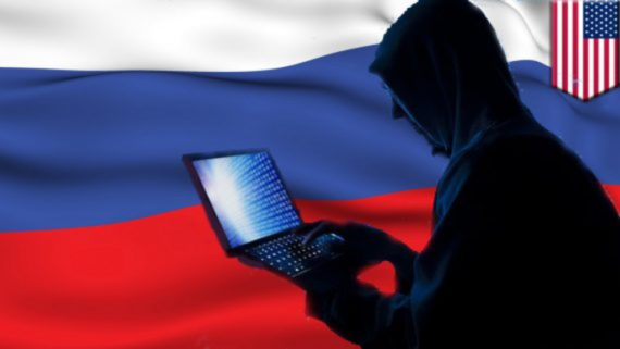 Russian Flag with Person with computer in front of it.