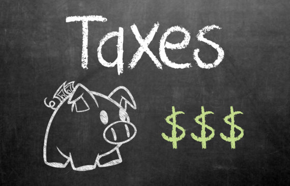 tax taxes pig piggybank dollar signs chalkboard