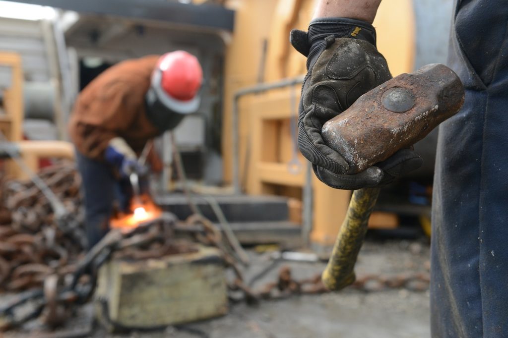 photo of working, person, military, construction, cutting, team, helmet, build, labor, job, workers, laborer, task, construction worker, sledge hammer