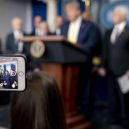 President Donald J. Trump is seen on a cellphone screen as he addresses his remarks at a White House Coronavirus Taskforce update briefing Monday, March 9, 2020, in the James S. Brady Press Briefing Room of the White House. (Official White House Photo by D. Myles Cullen)