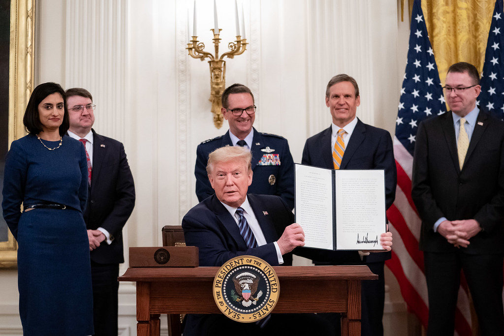 President Donald J. Trump displays his signature on a proclamation making the month of May Older Americans Month, during the America's Seniors event Thursday, April 30, 2020, in the East Room of the White House. (Official White House Photo by Tia Dufour)