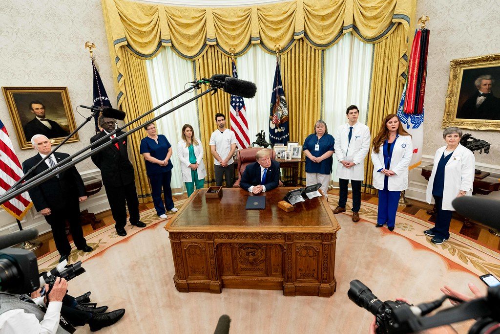 President Donald J. Trump and Vice President Mike Pence are joined by health care and nursing association representatives, from left to right-Dr. Ernest Grant, Lisa Barlow, Caroline Few Elliot, Luke Adams, Marty Blankenship, Allen Zelno, Sophia Thomas and Maria Arvonio, listening to a reporter's question after the signing of a proclamation in honor of National Nurses Day Wednesday, May 6, 2020, at the White House. (Official White House Photo by Andrea Hanks)