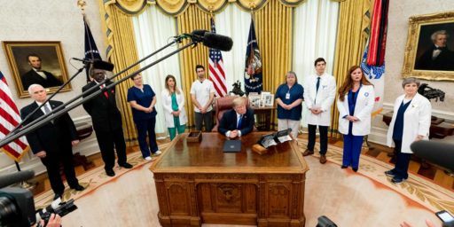 President Donald J. Trump and Vice President Mike Pence are joined by health care and nursing association representatives, from left to right-Dr. Ernest Grant, Lisa Barlow, Caroline Few Elliot, Luke Adams, Marty Blankenship, Allen Zelno, Sophia Thomas and Maria Arvonio, listening to a reporter’s question after the signing of a proclamation in honor of National Nurses Day Wednesday, May 6, 2020, at the White House. (Official White House Photo by Andrea Hanks)