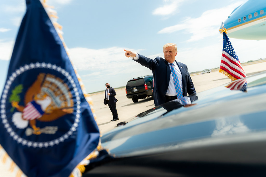 President Trump Travels to Texas President Donald J. Trump waves and gestures to the crowd upon his arrival to Midland International Air and Space Port in Midland, Texas, Wednesday, July 29, 2020, where he was greeted by Texas Gov. Greg Abbott, former Secretary of Energy Rick Perry, Texas Lt.Gov. Dan Patrick, Texas Republican Chairman Allen West, U.S. Representative candidates, and members of the community. (Official White House Photo by Shealah Craighead)