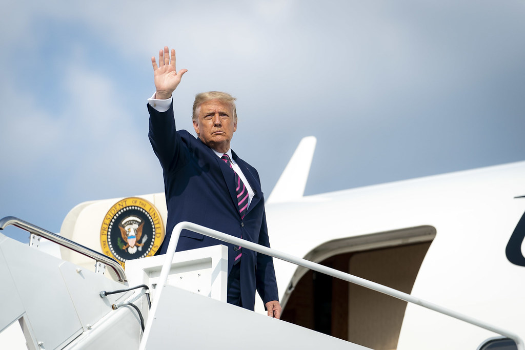 President Donald J. Trump disembarks Marine One at Joint Base Andrews, Md. Friday, Sept. 18, 2020, and is escorted to Air Force One by U.S. Air Force personnel. (Official White House Photo by Tia Dufour)