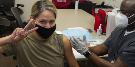 Major Kimberly Bender, Director Air Force Public Affairs , Joint Base San Antonio, Fort Sam Houston, receives the first of two COVID 19 vaccine shots, Brooke Army Medical Center, Joint Base San Antonio, Fort Sam Houston, Texas, 29 Jan 2021.