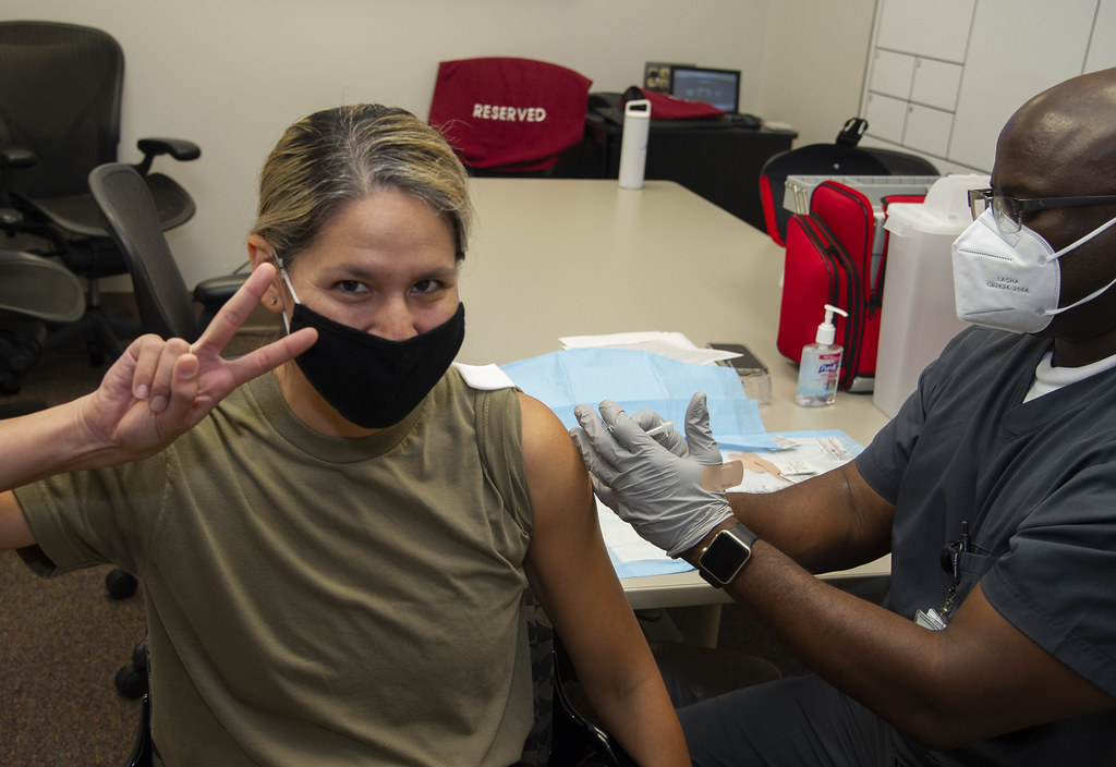 Major Kimberly Bender, Director Air Force Public Affairs , Joint Base San Antonio, Fort Sam Houston, receives the first of two COVID 19 vaccine shots, Brooke Army Medical Center, Joint Base San Antonio, Fort Sam Houston, Texas, 29 Jan 2021.