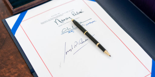 The signatures of House speaker Nancy Pelosi, Senator Majority Leader Charles “Chuck” Schumer and President Joe Biden are seen on the “American Rescue Plan Act of 2021” Thursday, March 11, 2021, in the Oval Office of the White House.