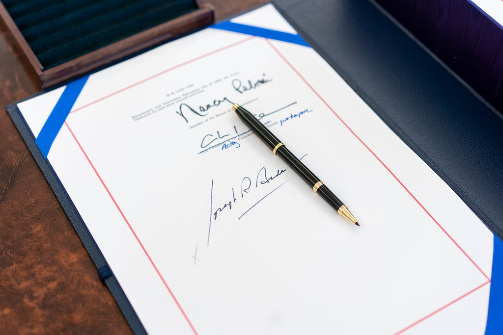 The signatures of House speaker Nancy Pelosi, Senator Majority Leader Charles 