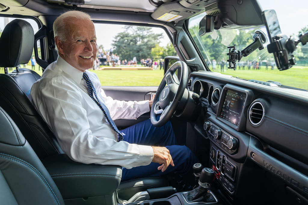 President Joe Biden drives a Jeep Wrangler Rubicon during a clean cars event, Thursday, August 5, 2021, on the South Lawn Driveway of the White House.