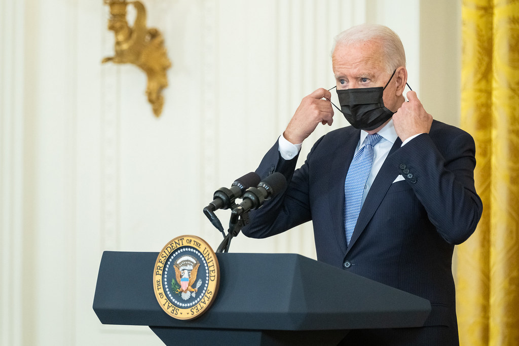 President Joe Biden takes his mask off to deliver remarks on COVID-19 and the economy, Thursday, July 29, 2021, in the East Room of the White House. (Official White House Photo by Adam Schultz)