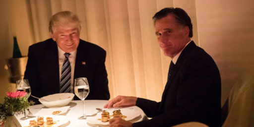 Mitt Romey with pained look on face as he has dinner with President-Elect Trump.