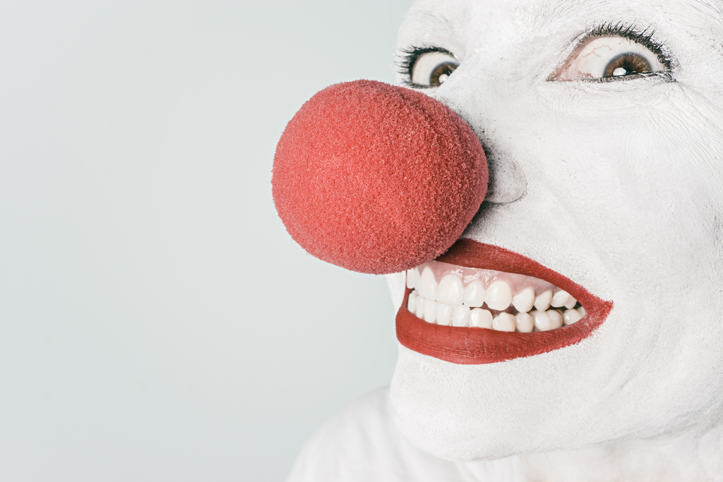 photo of man, person, white, red, artist, pink, toy, smiling, smile, makeup, mouth, close up, human body, laughing, clown, face, nose, happy, head, funny, humour, painted, organ, circus, emotion, comedy, joke, comedian, grinning, stuffed toy, joking